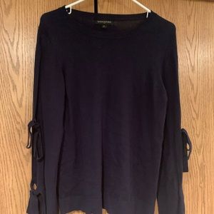 Navy sweater with cutout arms and bows